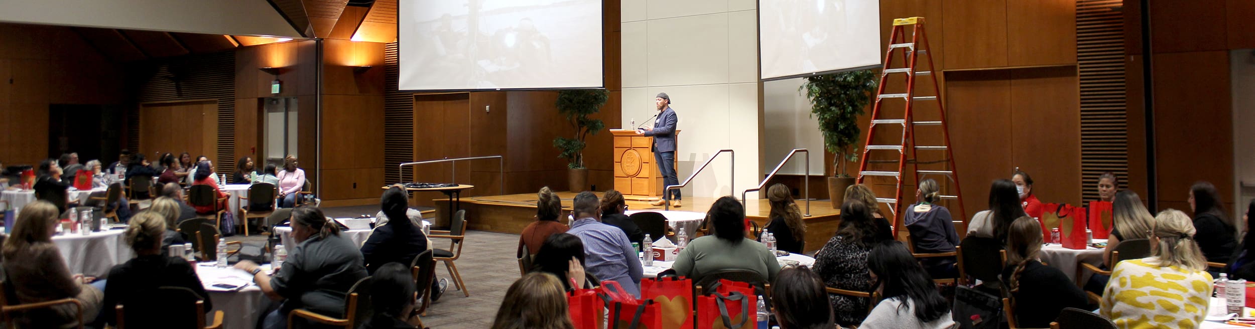 Ari Speaking at a Conference